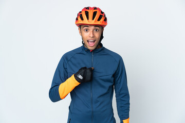 Young cyclist Brazilian man isolated on white background with surprise facial expression