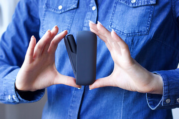 close up of female hand showing electronic cigarette