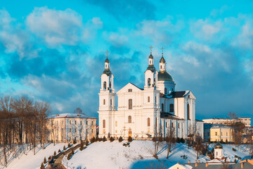 Vitebsk, Belarus. Famous Landmark Is Assumption Cathedral Church In Upper Town On Uspensky Mount Hill And Pushkin Bridge In Sunny Winter Day