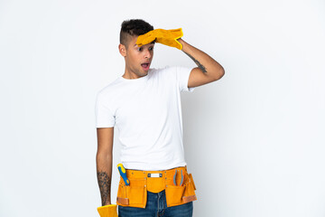 Young Brazilian electrician manipulated isolated on white background doing surprise gesture while looking to the side