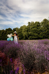 Portrait of a woman in a lavender field, aromatherapy and a walk in a fragrant field, a feeling of freshness and joy from the walk.