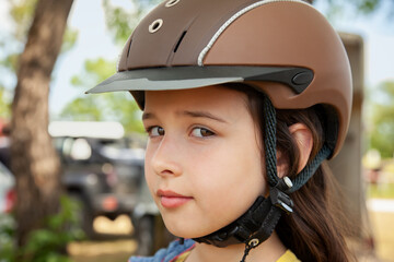 Close up of a Girl Waiting for a Horse Riding Lesson