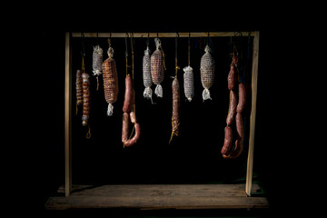 Salamis, sausages and other sausages mature in darkness and freshness