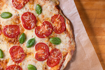 Homemade pizza with tomatoes and cheese