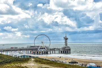 Scheveningen. Beautiful view of the pier of Scheveningen, with bungy jump, ferris wheel, dunes and beach. denhaag, netherlands, thehague, holland, europe	