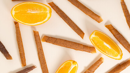 fruit roll up with orange top view. Pattern of fruit pastille. Vegan homemade sweets
