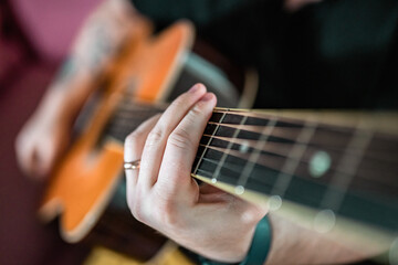 Man playing guitar. Close-up view