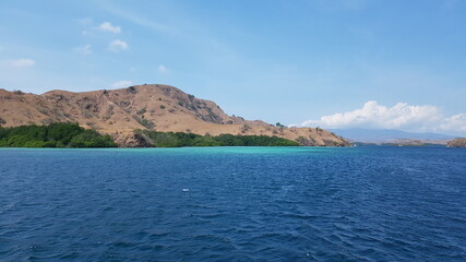 Naklejka premium mountains, hills, close to the ocean in labuan bajo
