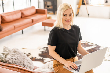 young beautiful woman using a laptop computer at home