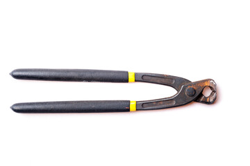 rusty pincers with plastic handle