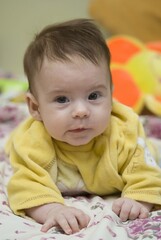 child with yelow dress