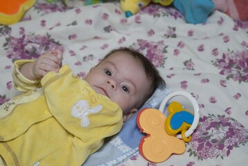 child with yelow dress