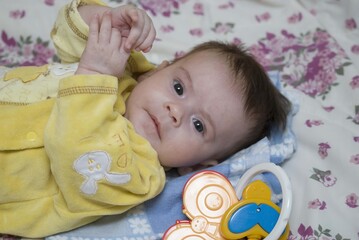 child with yelow dress