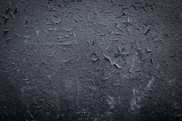 The old grunge texture of black paint-painted metal. Blackout to the corners of the background