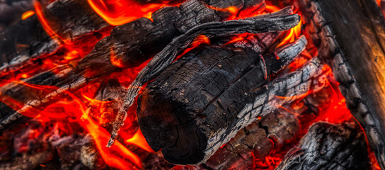 Close up picture of wood burning in a camp fire. Hot Red Flames. Taken in British Columbia, Canada.