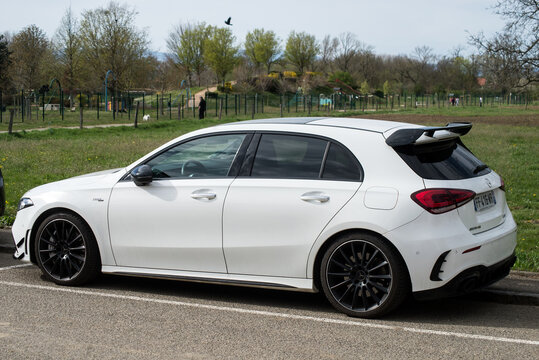 Mulhouse - France - 9 April 2021 - Front view of white Mercedes A 180  parked on countryside road
