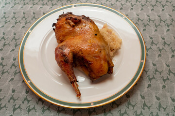 Half Roast or Braised Pheasant on Sauerkraut, on a Plate, in Traditional Alsatian Style