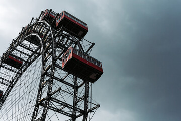 Ferris wheel in an amusement park.Blue sky. Copy space