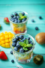 Rainbow fruit salad in a glass