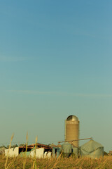 vertical shot of a destroyed barn from a natural disaster