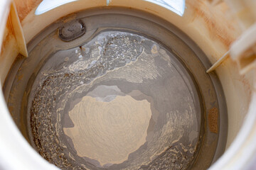 Limescale, scale in old kettle isolated on white. A white, chalky residue from deposit of calcium...