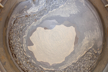 Limescale, scale in old kettle isolated on white. A white, chalky residue from deposit of calcium...