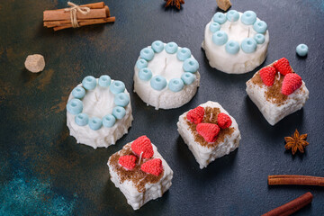 Beautiful colorful bright candle made in the form of an appetizing cake. Aromatherapy, candle with the smell of herbs