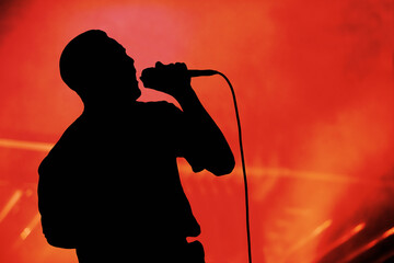 Silhouette of a singer having performance on the stage