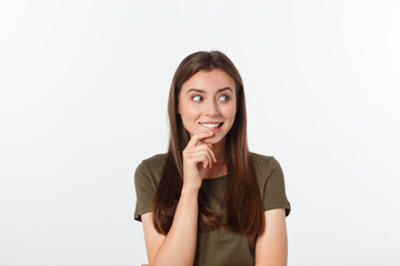 amazement - woman excited looking to the side. Surprised happy young woman looking sideways in excitement. Mixed race Asian and white Caucasian female model on grey background.
