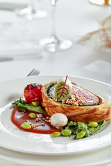 Easter meat roll, meatloaf for Easter dinner. Beautifully decorated catering banquet table with different food snacks and appetizers