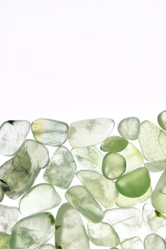 Prehnite rare jewel texture on half white light isolated background. Place for text.