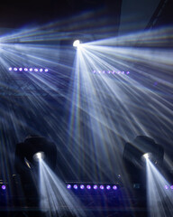 Spotlights on stage with smoke and light
