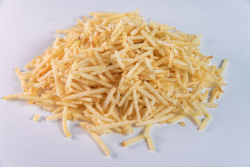 White bowl with potato straw on white background