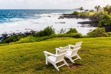 White Chairs Overlooking The Rugged Shore of Kaihalulu Bay, Hana, Maui, Hawaii, USA