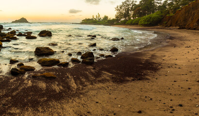 Fototapeta na wymiar Sunset on Koki Beach With Alau Island in The Distance, Koki Beach Park, Hana, Maui, Hawaii, USA