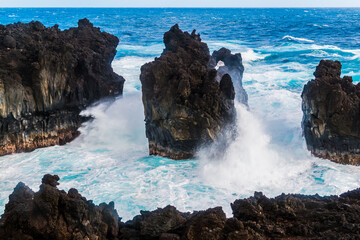 Waves Crashing Against The Black Basalt Lava Shelf at Pakulua Point, Waianapanapa State Park, Maui,...