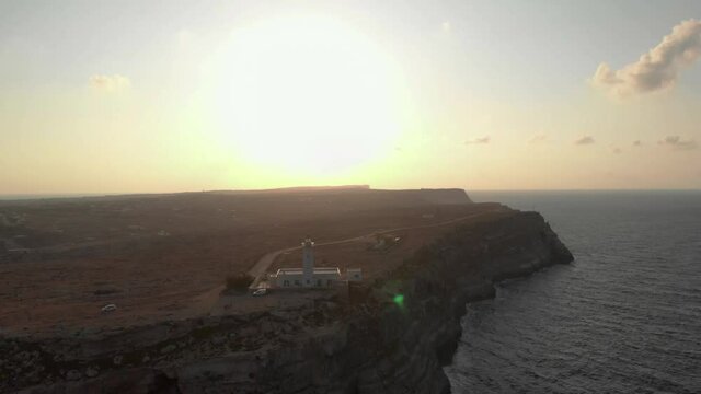 Aerial shot Lampedusa Island (Drone 4k), seagulls, isola dei conigli at sunset - concept of paradise on earth, happiness and travel to beautiful places