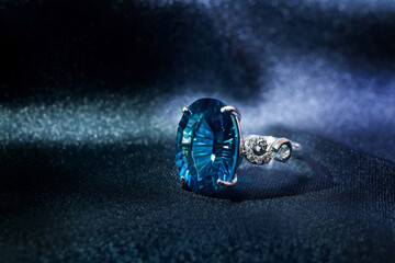 White gold ring with London Topaz gemstone, concave cut