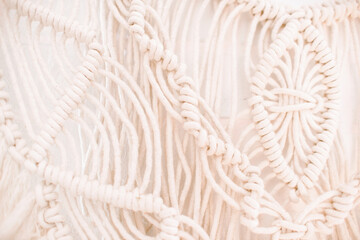 wall panel in boho style made of cotton threads of natural color