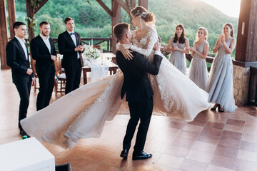 The first dance of the young. The bride and groom are dancing their first dance.