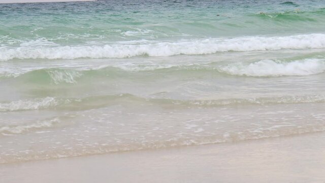 Ocean waves crashing on white sand beach, beautiful natural scene of tropical summer sea beach