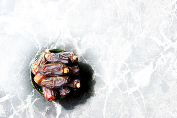 white marble textured floor and dry date bowl