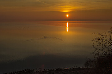 Fototapeta premium reflection of the sun during sunrise