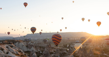 Daily take-off of balloons in Cappadocia, on the city of Goreme, Turkey.