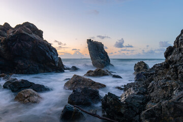 Dawn view of Pinnacle rock in high tide, Port Macquarie, Australia.