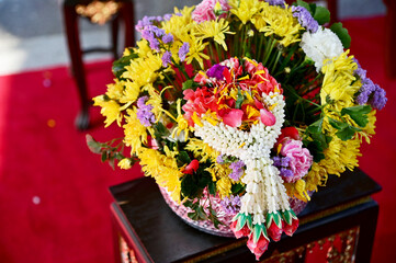 Thai traditional flower garland on fresh flowers for blessing ceremony of adults in Songkran festival or Thai new year in Thailand. 
