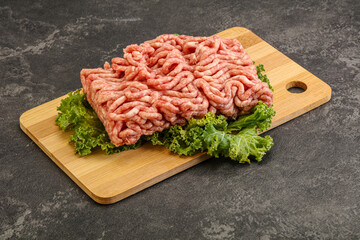 Raw pork minced meat over board