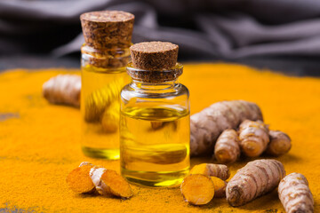 Turmeric essential oil, orange root and powder, beauty and spa