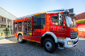 Red and yellow modern fire fighter truck equipped with the latest tools for rescue operations...