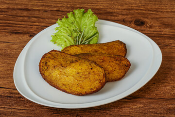 Baked potato with herbs and spices